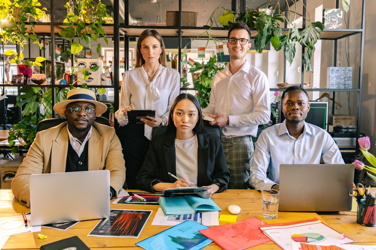 Diverse American workers — office employees, healthcare staff, retail and service workers — who qualify for Lendly payroll-deduction loans regardless of credit score
